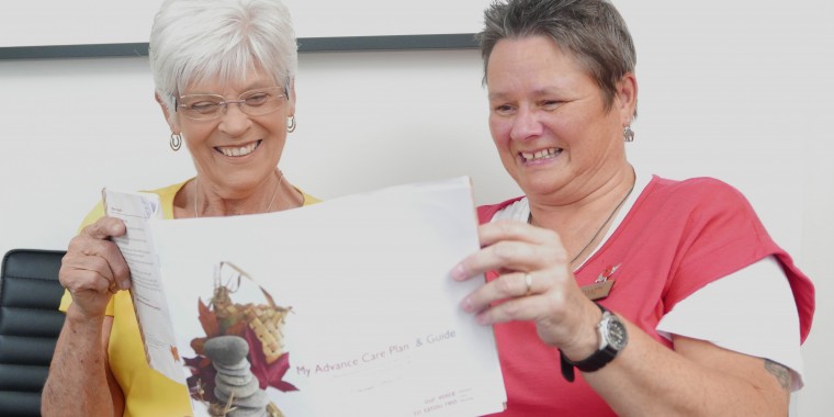 two women reading an Advanced Care Plan