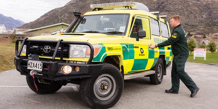 A man entering a 4WD emergency vehicle 