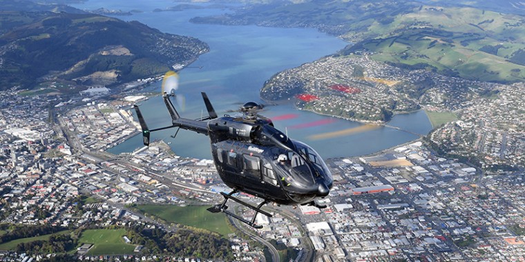 Helicopter flying over dunedin