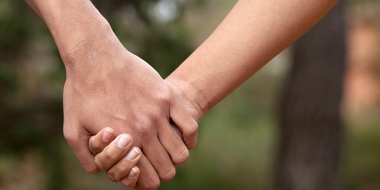 A couple holding hands