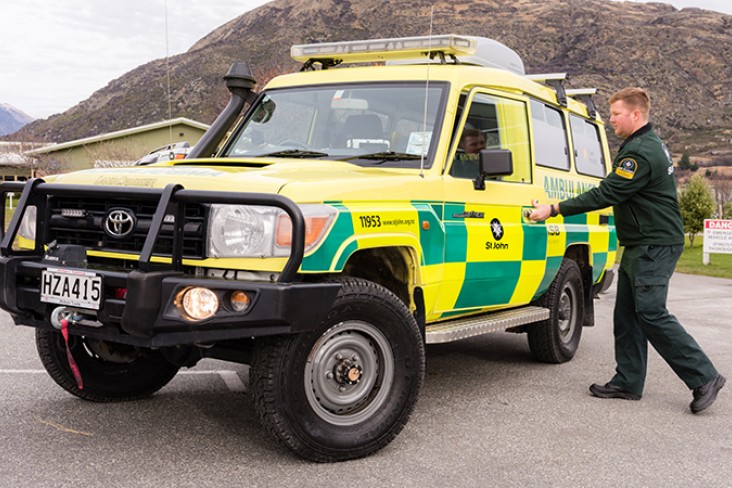 A man entering a 4WD emergency vehicle 