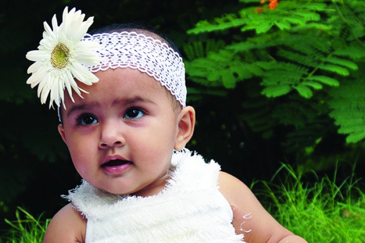 baby with flower in hair