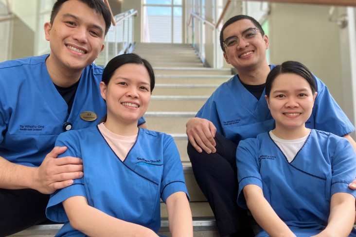 Jerico Esquerra with his wife Clarise, on the left, and Pauz Diaz with his wife Claire. 