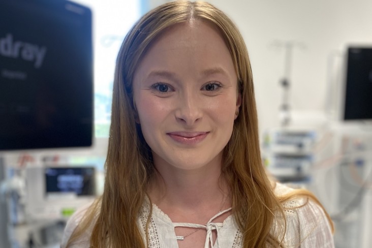A young woman standing in ICU