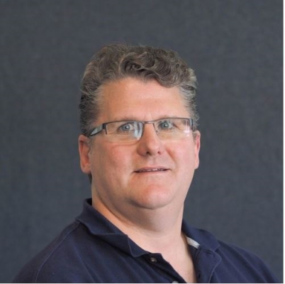 Man with glasses looking at the camera